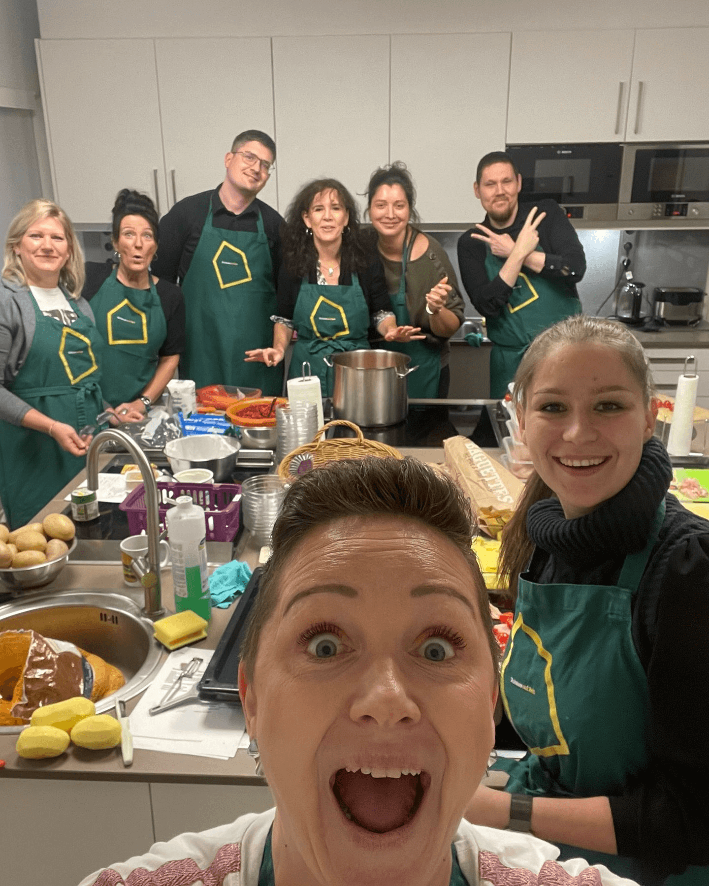 Group photo of employees cooking at Ronald McDonald House 2024